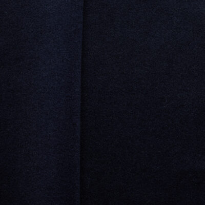 Navy brushed wool coating fabric, flat lay showing dense weave and soft surface texture