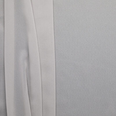 Grey poly chiffon fabric, flat lay showing soft drape and sheer quality